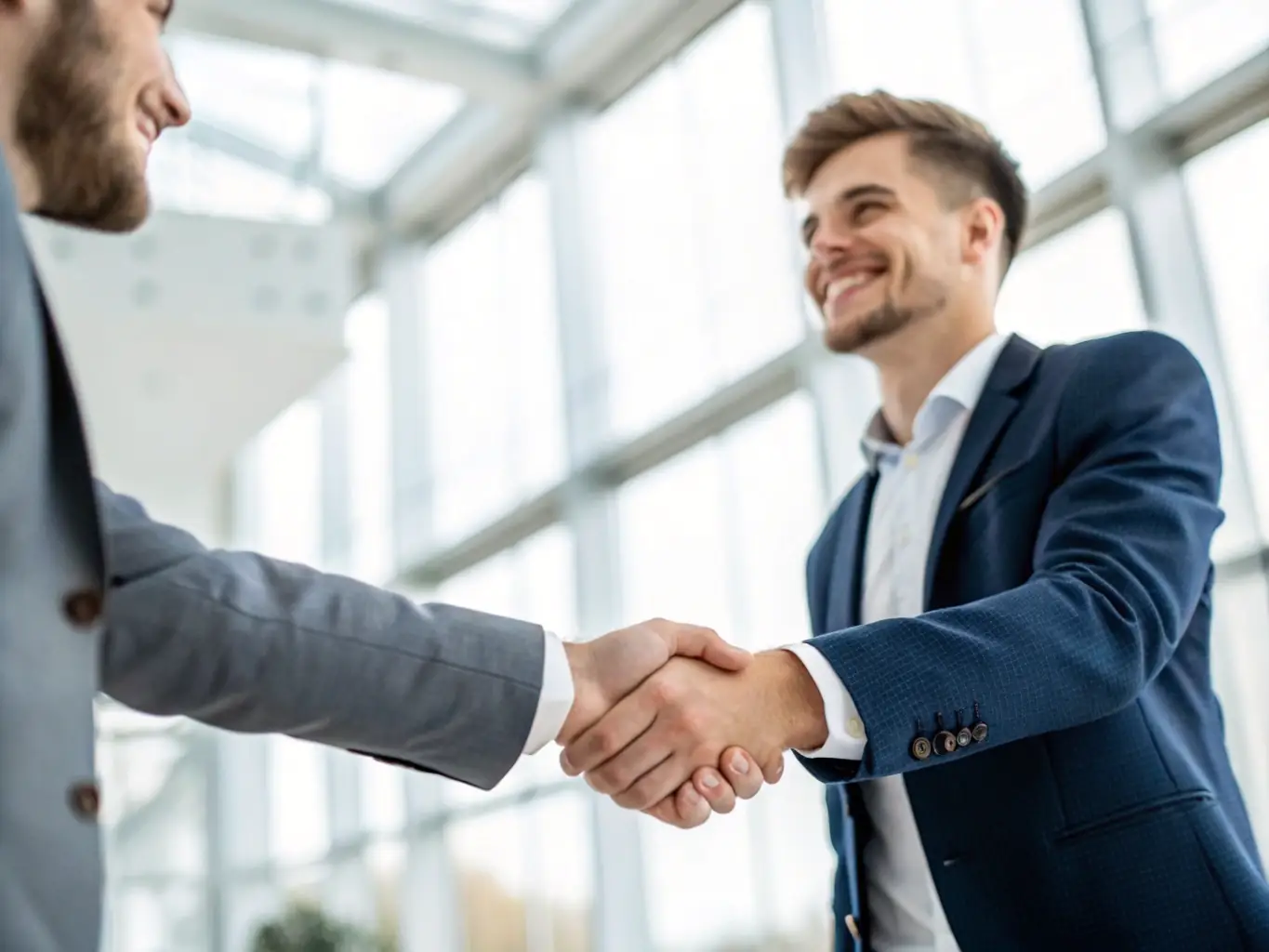 An image of a startup CEO shaking hands with an investor, representing successful investor relations and funding acquisition.