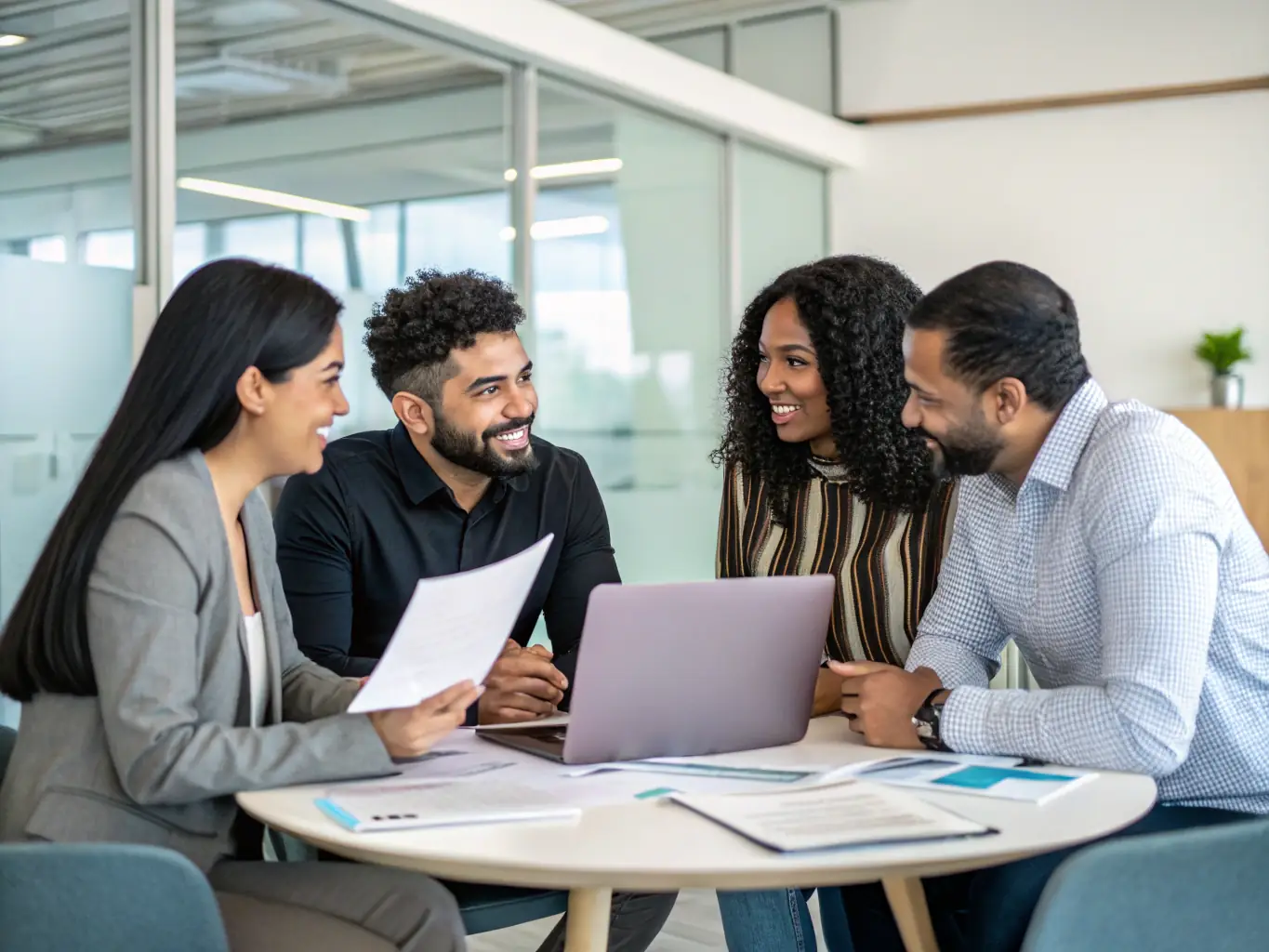 An image of a diverse group of startup founders collaborating on financial projections in a modern office space, symbolizing strategic financial planning.
